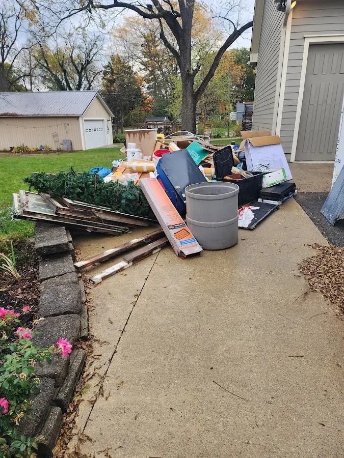 Dumpster being loaded with debris for Demolition Dumpster Rental in Seneca